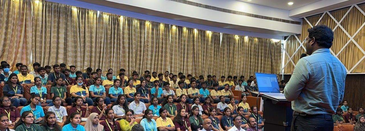 Trainer addressing a full auditorium of engineering students during a placement training seminar